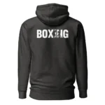 Hoodie unisexe avec, imprimé au dos, le mot « BOXING » en lettres noires où le I et le N laissent apparaître en négatif deux boxeurs en plein échange de coups. (Anthracite chiné, mockup principal) Hoodie unisexe avec, imprimé au dos, le mot « BOXING » en lettres noires où le I et le N laissent apparaître en négatif deux boxeurs en plein échange de coups. (Anthracite chiné, mockup principal)