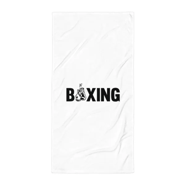 Serviette de plage blanche imprimée du mot BOXING en lettres noires épaisses, dont le O est remplacé par une paire de gants de boxe suspendus. (Blanc, mockup principal)